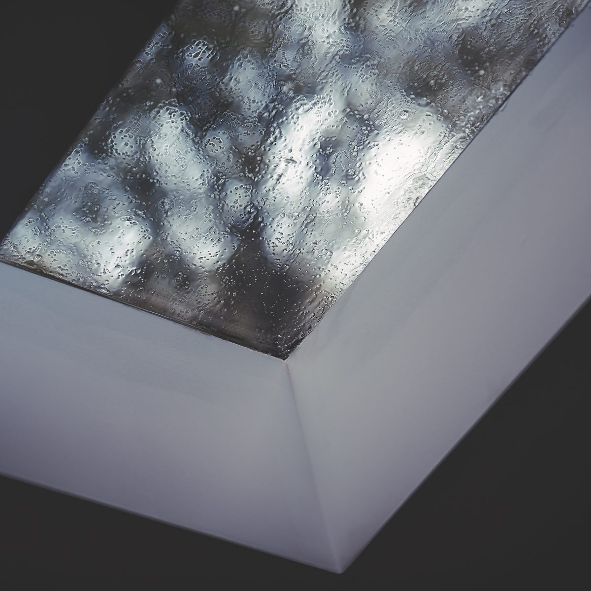Close-up of LivingSpace sunroom structural joint showing premium aluminum framing and glass seals
